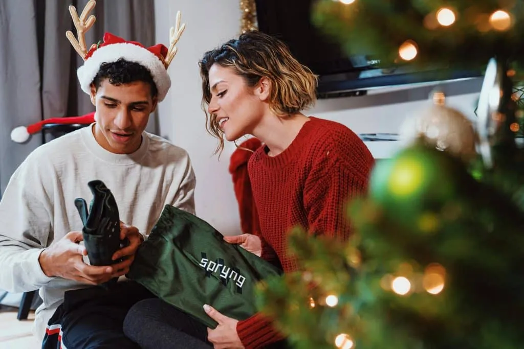 Warm family scene composed around the Christmas tree