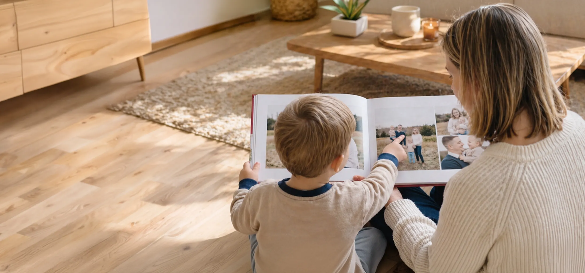 Mother and child looking at a printed photo book